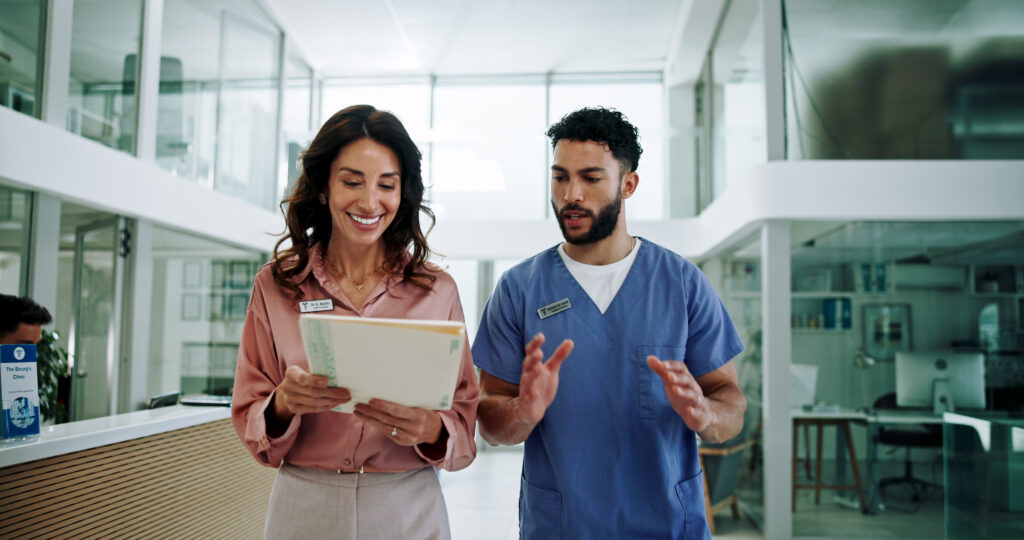 Medical care planning team reviewing records in a hospital setting
